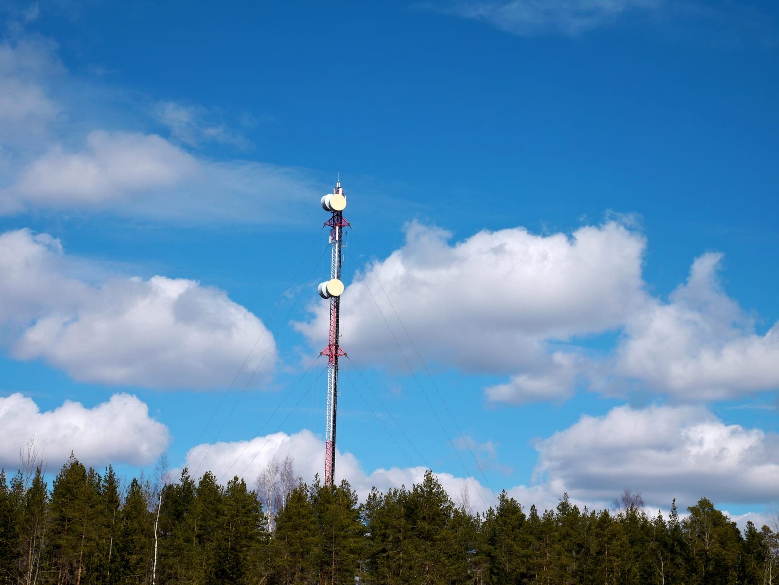 Mobile phone mast against the sky, illustrating telecom infrastructure